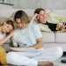 A family enjoying quality time in a comfortable living room setting.