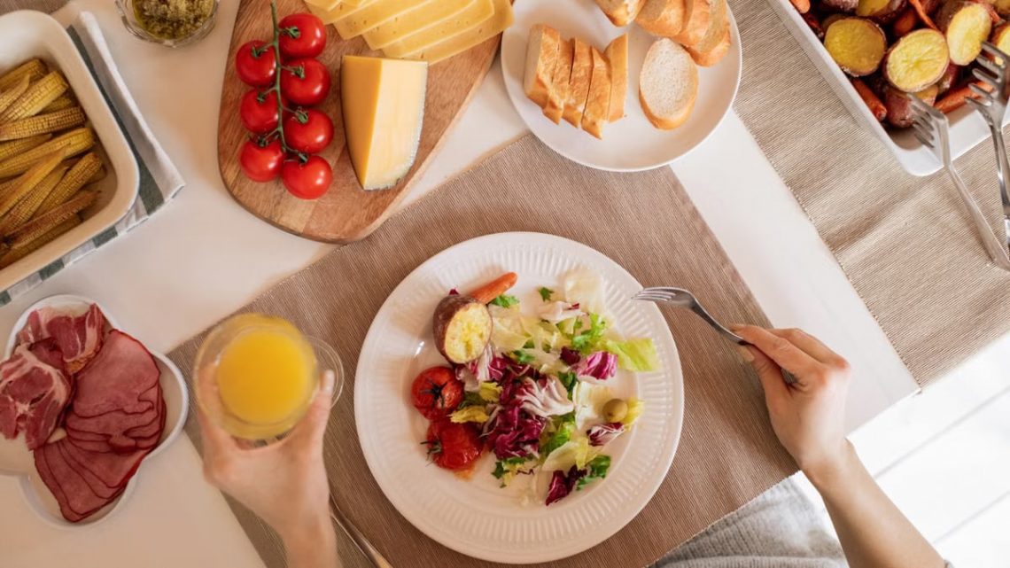 Top view of a delicious homemade meal with cheese, salad, and assorted ingredients.